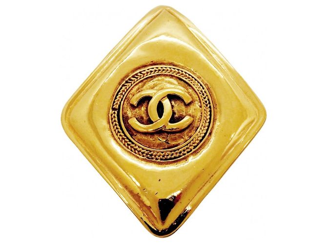Spilla Chanel placcata oro D'oro