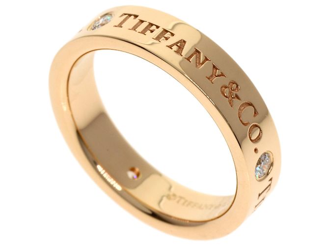 Anel Tiffany & Co. de ouro rosa 18K com banda plana e 3 diamantes