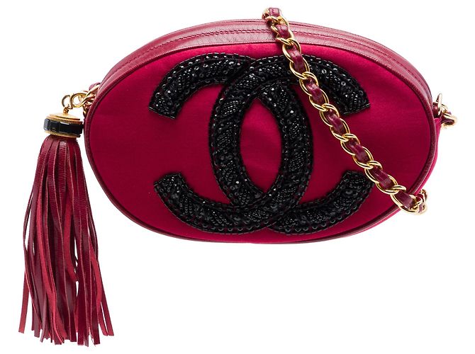 Sac bandoulière ovale en daim rouge avec logo CC et pompon Chanel