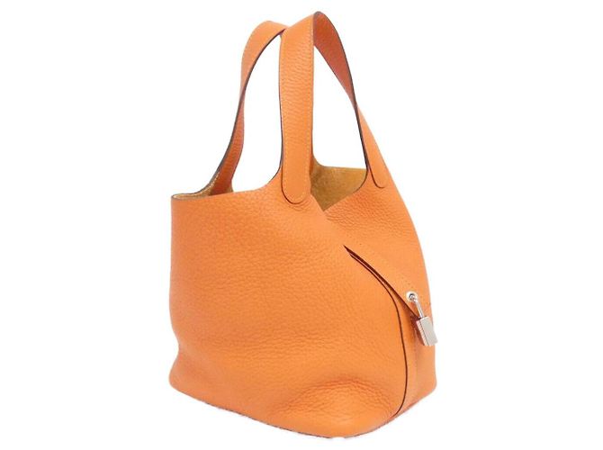 Bolsa Hermès Picotin Lock PM Taurillon Clemence Laranja