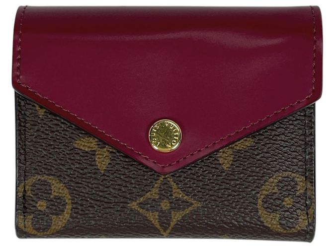 Cartera tríptico Louis Vuitton Portefeuille Zoe Castaño Fucsia