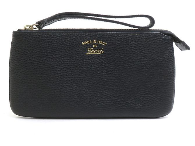 Clutch de cuero negro Gucci