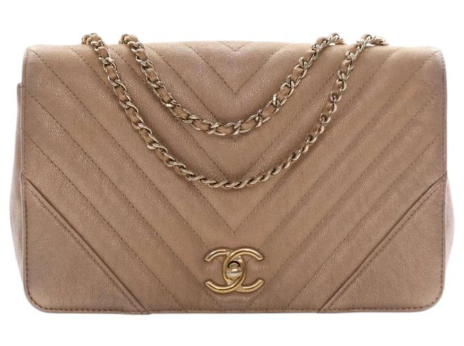 Chanel Gold Medium Chevron Iridescent Caviar Statement Flap Doré