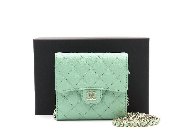Chanel Mini bolsa transversal com corrente dourada