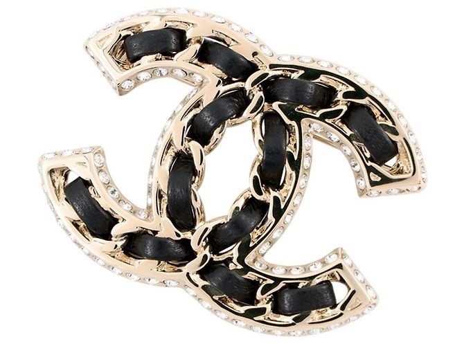 Broche Chanel dourada com strass e couro Dourado