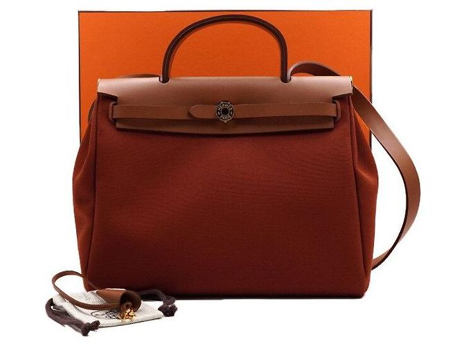 Hermès Tote e bolsa de ombro em couro laranja com ferragens