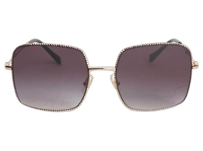 Miu Miu Black and gold square frame sunglasses