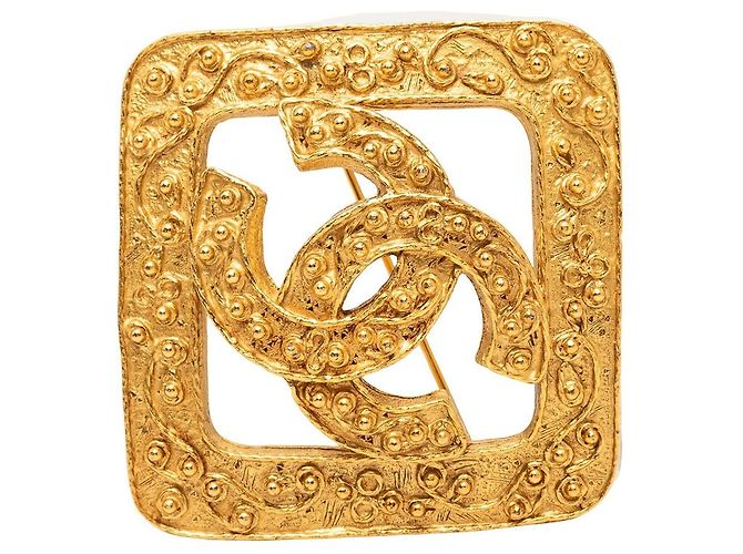 Spilla Chanel CC placcata oro e diamanti D'oro