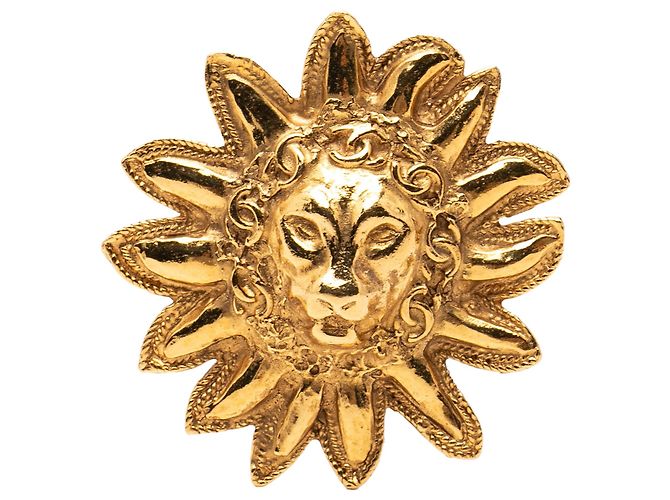 Broche Chanel banhada a ouro Cabeça de Leão e Sol Dourado