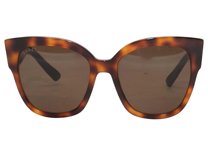 Occhiali da sole Gucci con borchie tartarugati Marrone