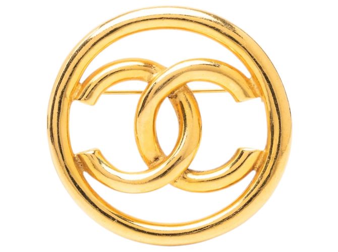 Spilla rotonda Chanel CC placcata oro D'oro