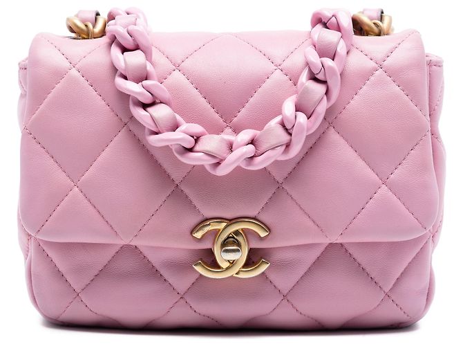 Bolsa transversal Chanel Mini Candy em pele de cordeiro acolchoada rosa com corrente