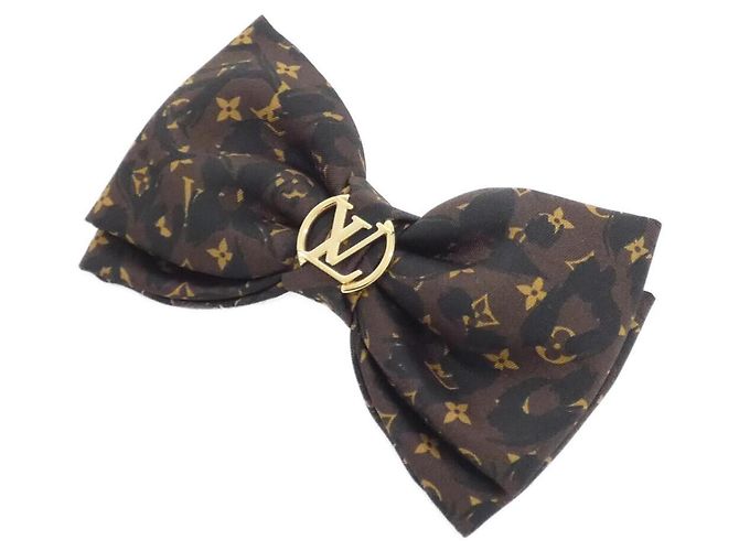 Fermi capelli Louis Vuitton Monogram Leopard Marrone