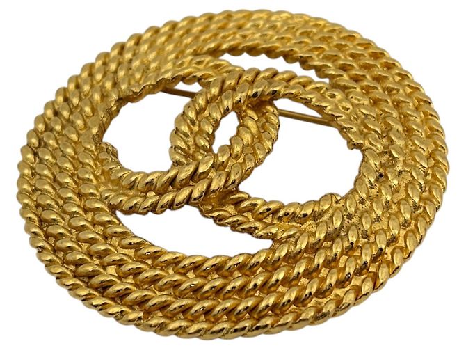 Spilla Chanel placcata oro D'oro