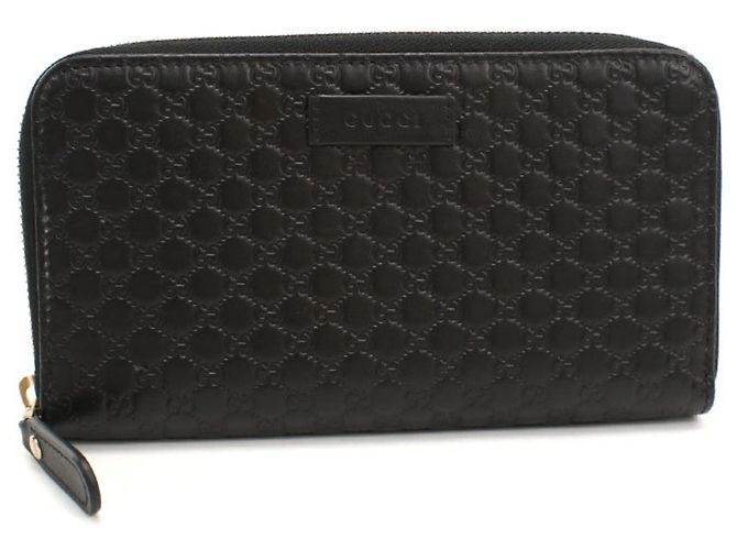 Cartera larga bi-fold Gucci en cuero negro
