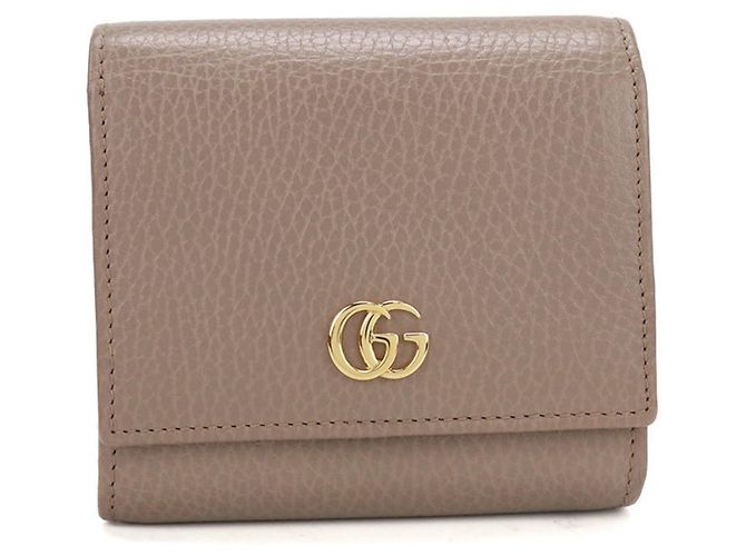 Cartera bi-fold Gucci en Beige
