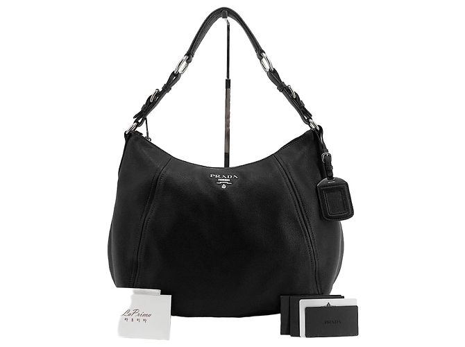 Balenciaga Bolsa hobo em couro com logo triangular, bolsa de ombro Preto