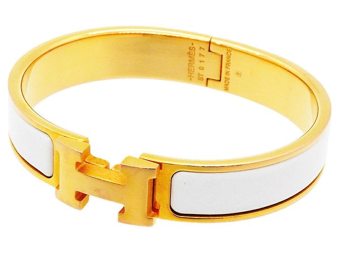 Brazalete Hermès Clic Clac PM Oro y Blanco Dorado