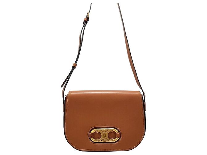 Céline Borsa a tracolla Marlon Triofe Marrone