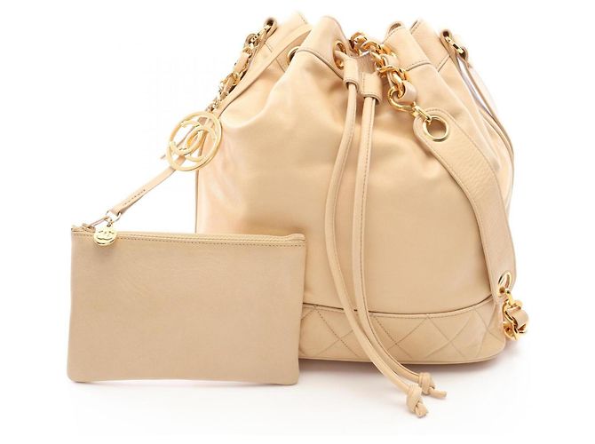 Sac à main à cordon Chanel Coco Charm Beige
