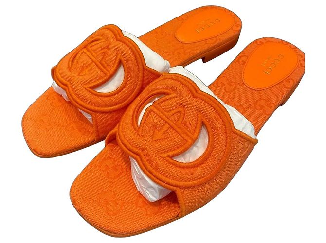 Gucci orange canvas mules