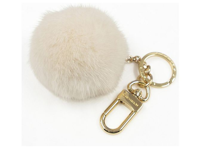 Chaveiro de pele de vison Louis Vuitton Dourado Cru