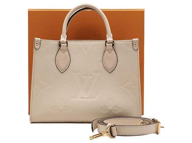 Louis Vuitton Borsa a mano e a tracolla OnTheGo PM Monogram Empreinte Cream Marrone