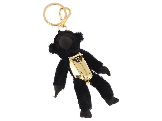 Charm Gorilla PRADA in metallo nero e oro Auth 196727M