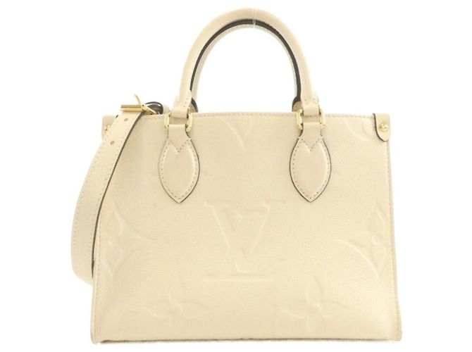 Bolsa Louis Vuitton Monogram Empreinte OnTheGo PM Bege
