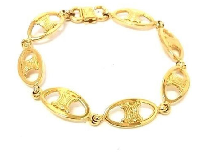 Céline Pulsera con dije de metal dorado Celine Macadam