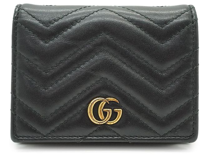 Gucci Carteira compacta e porta-moedas GG Marmont em couro acolchoado preto