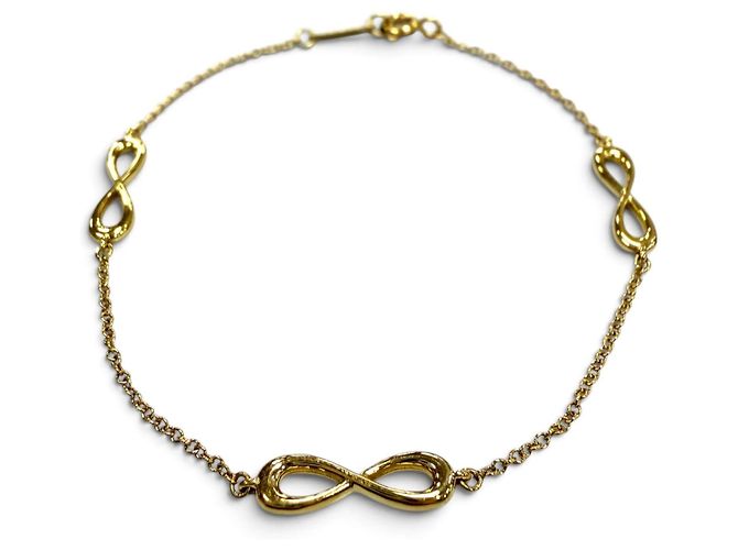 Tiffany & Co Pulsera de amuletos Tiffany Infinity Endless en oro amarillo Dorado