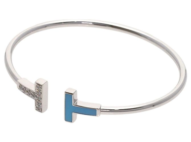 Bracciale con charm in oro bianco e diamanti Tiffany & Co.