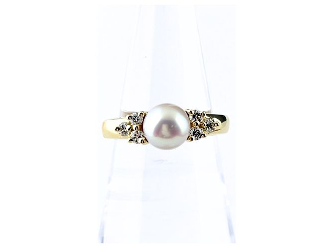 Anillo banda Tiffany & Co. de oro amarillo con diamantes y perla