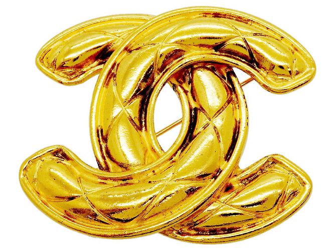 Spilla Chanel placcata oro D'oro