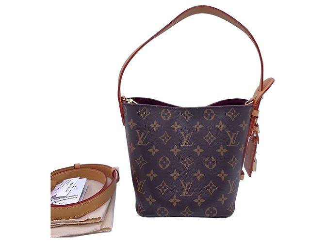 Bolsa bucket Louis Vuitton Monogram Marrom