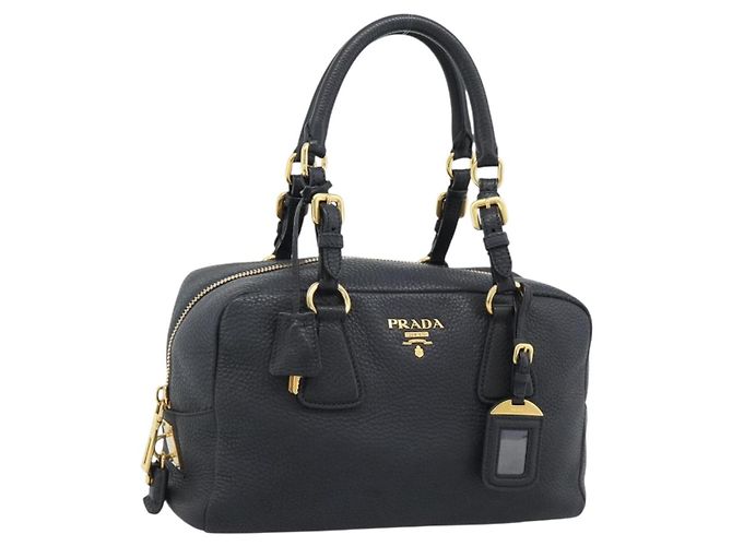 PRADA Bolsa de mão em couro preto tom dourado