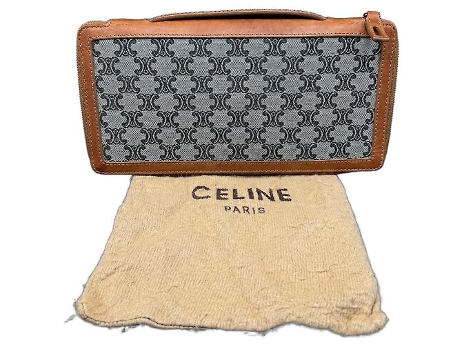 Céline Celine Triomphe zipped wallet in coated canvas and leather Brown Monogram