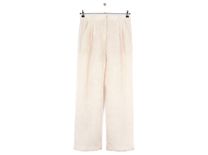 Autre Marque Pantalones rectos beige THE GARMENT
