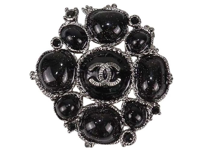 Spilla Chanel in Gripoix metallico nero e cristalli