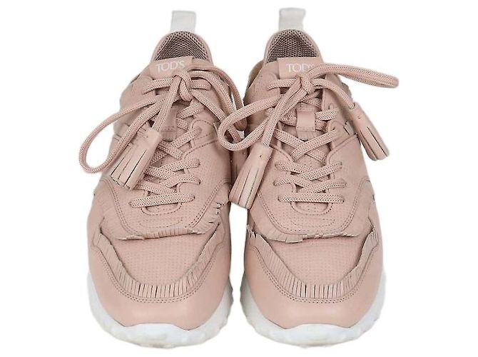 Baskets basses Tod's en cuir perforé rose avec franges et pompons