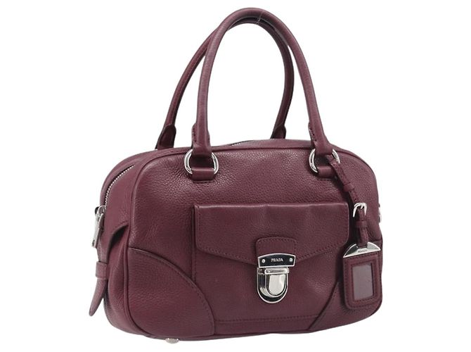 Prada Boston Convertible Small em Vitello Daino com bolso frontal e fecho pushlock Bordeaux