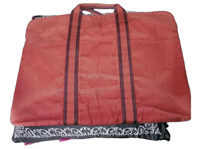Bolso de viaje de lona roja Hermès