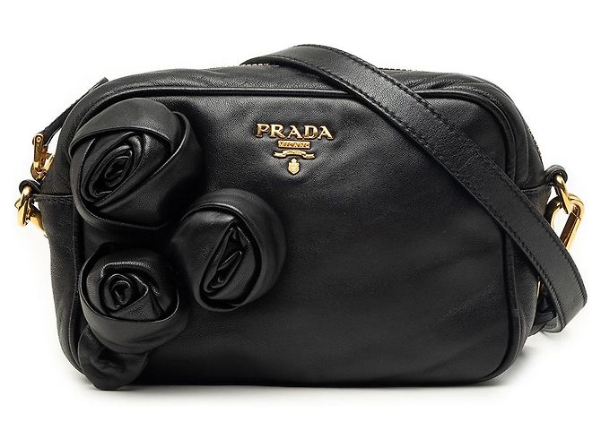 Bolsa tiracolo Prada em nappa preta com roseta Preto