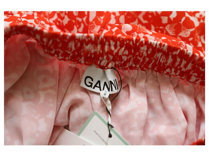 Falda midi Ganni Mini Floral en seda con estampado naranja