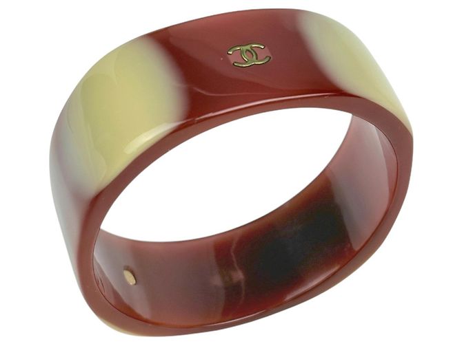 Bangles Chanel in plastica marrone