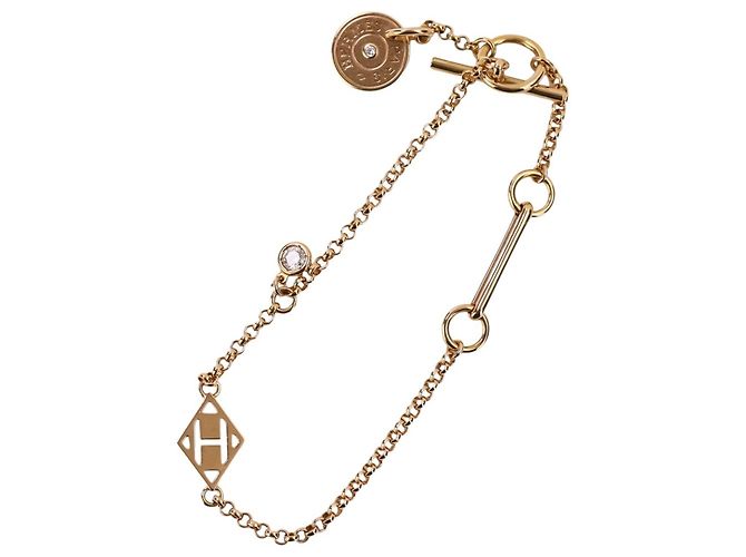 Hermès Set de Pulsera de Dijes Hermes Gambard Dorado