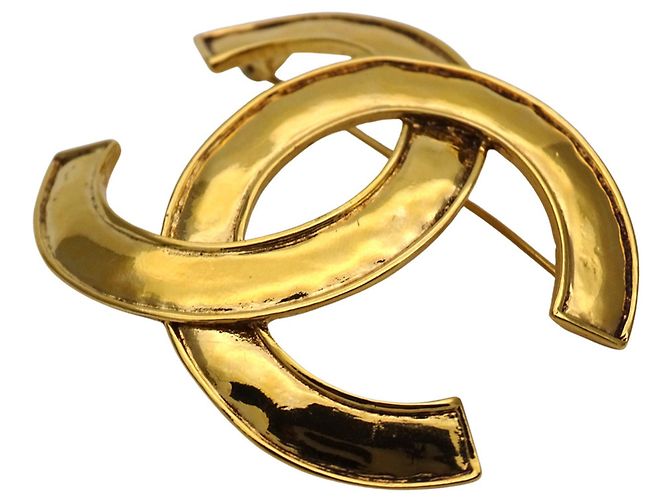 Spilla Chanel placcata oro D'oro