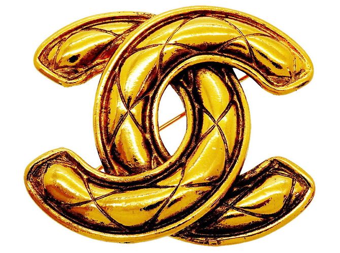 Spilla Chanel placcata oro D'oro