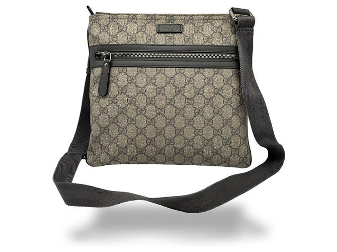 Borsa Messenger piatta Gucci con zip frontale in GG coated canvas Medium Beige